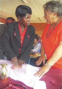 <p style="font-size: 15px">Global Outreach: Parish Nurse Emma Jackson RN (right)in Zimbabwe, Africa